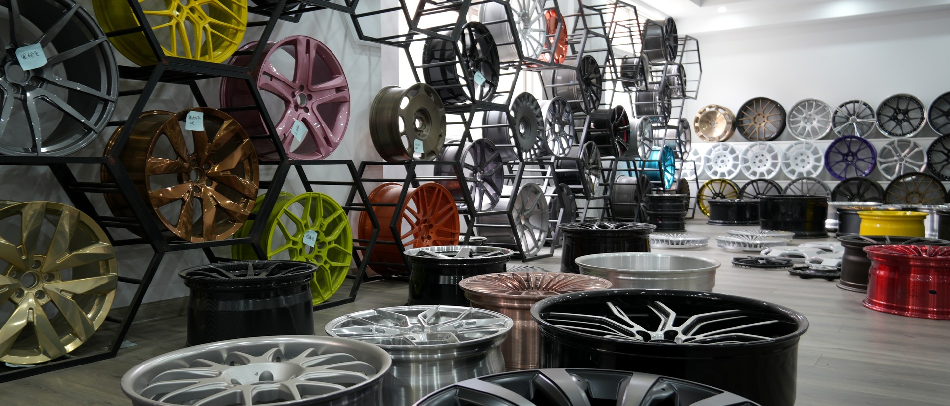 About Us VENXAN forged wheel showroom — hundreds of designs and finishes on display